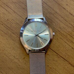 Michael Kors gold toned metal watch needs battery